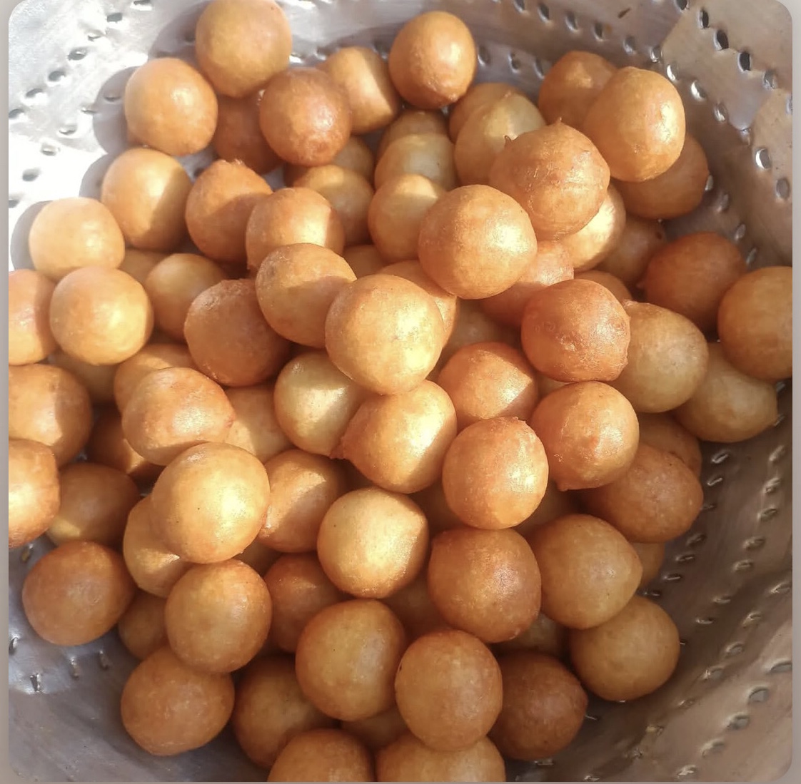 Image-of-no-yeast-puff-puff-in-a-silver-sieve-for-how-to-make-puff-puff-without-yeast