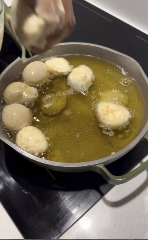 molding-the-puff-puff-with-hand-to-form-a-perfect-shape