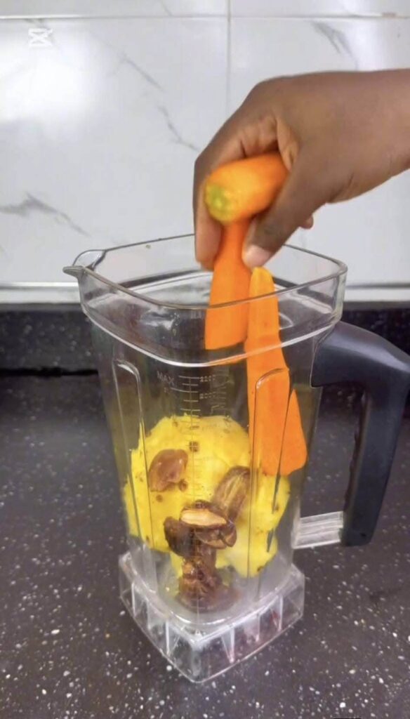 adding-the-carrots-in-the-blender-to-blend