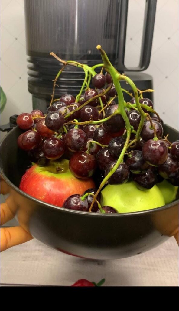 plums-and-apple-in-a-bowl
