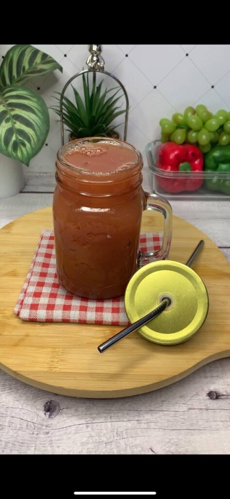 plums-and-apple-juice-in-a-glass-cup